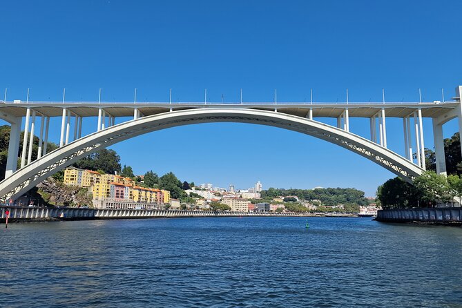 Porto: 6 bridges tour, Douro river with 4 Port Wine tasting - North Bank Landmark Time: A Standout Building on the Douro